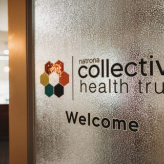 A door welcomes guests to the Health Trust