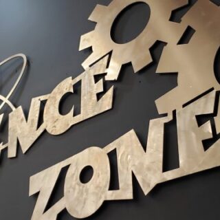 a medal sign with words The Science Zone