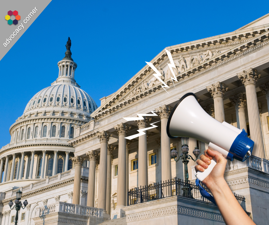 A hand holding a megaphone with US Capitol in the background
