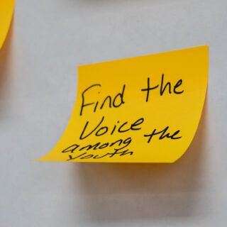 A sticky note reads: Find the voice among the youth.
